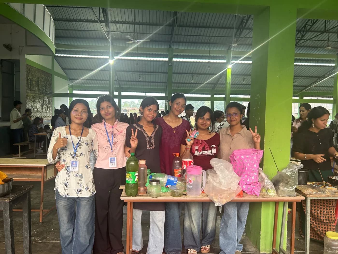 Six students at their refreshments stall