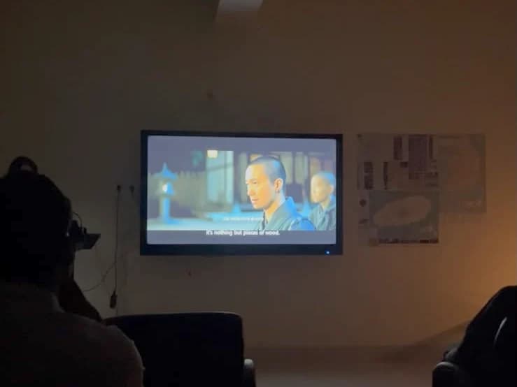 A scene from the film on the screen